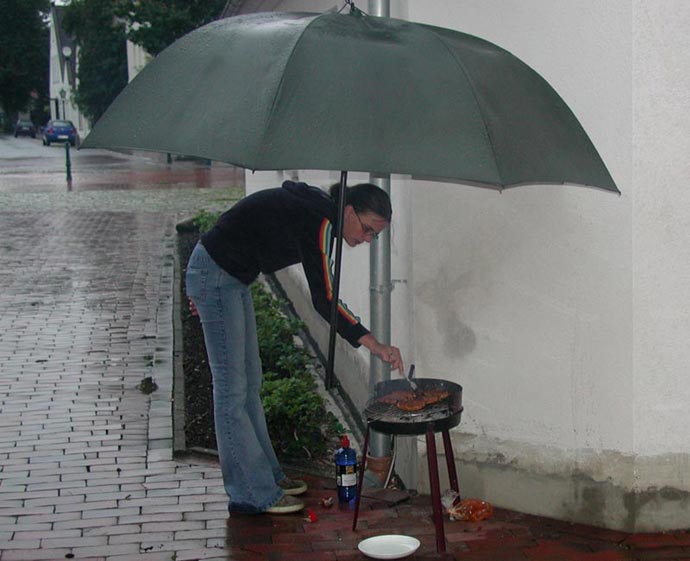 Silly at barbecue in rain